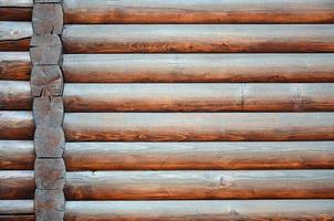 Hewn timber. Rustic log wall horizontal timber background photo