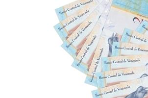 2 Venezuelian bolivar bills lies isolated on white background with copy space. Rich life conceptual background photo