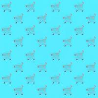 Shopping addiction, shopping lover or shopaholic concept. Many small empty shopping carts perform a pattern on a pastel colored paper background. Flat lay composition, top view photo
