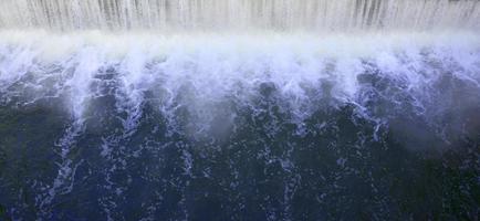 Falling water with strong bursts photo