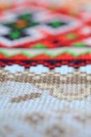 Traditional Ukrainian folk art knitted embroidery pattern on textile fabric photo