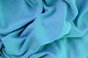 The texture of the fabric in blue color. Material for making shirts and blouses photo