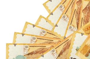 1000 Kazakhstani tenge bills lies in different order isolated on white. Local banking or money making concept photo