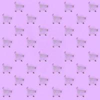 Shopping addiction, shopping lover or shopaholic concept. Many small empty shopping carts perform a pattern on a pastel colored paper background. Flat lay composition, top view photo