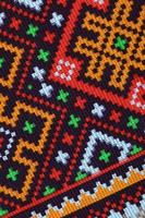 Traditional Ukrainian folk art knitted embroidery pattern on textile fabric photo