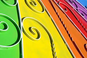 Metal texture of a piece of colored wall with a forged pattern photo