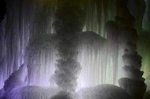 Large blocks of ice frozen waterfall or cavern background photo