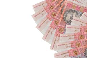 10 billetes de hryvnias ucranianos se encuentran aislados en fondo blanco con espacio de copia. fondo conceptual de vida rica foto