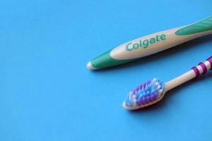 TERNOPIL, UKRAINE - JUNE 23, 2022 Colgate toothbrushes, a brand of oral hygiene products manufactured by American consumer-goods company Colgate-Palmolive photo