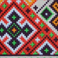 Traditional Ukrainian folk art knitted embroidery pattern on textile fabric photo