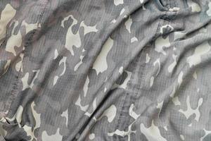 Camouflage background texture as backdrop for military video games and design projects photo