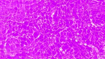 Defocus blurred transparent purple colored clear calm water surface texture with splashes and bubbles. Trendy abstract nature background. Water waves in sunlight. Purple water shining background. video