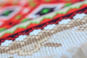 Traditional Ukrainian folk art knitted embroidery pattern on textile fabric photo