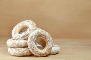 Glazed bagels on wooden table photo