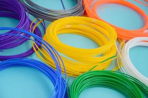 Plastic PLA and ABS filament material for printing on a 3D pen or printer of various colors photo