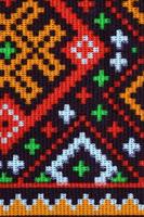 Traditional Ukrainian folk art knitted embroidery pattern on textile fabric photo