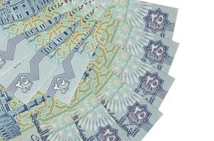 25 Egyptian piastres bills lies isolated on white background with copy space stacked in fan shape close up photo