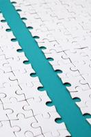 The blue path is laid on the platform of a white folded jigsaw puzzle. Texture image with copy space for text photo