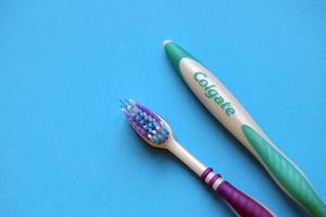 TERNOPIL, UKRAINE - JUNE 23, 2022 Colgate toothbrushes, a brand of oral hygiene products manufactured by American consumer-goods company Colgate-Palmolive photo