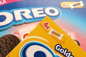 TERNOPIL, UKRAINE - MAY 28, 2022 Oreo golden and strawberry cheesecake crispy cookie box. The brand Oreo is owned by company Mondelez international photo