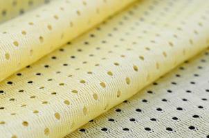 Yellow mesh sport wear fabric textile background pattern photo