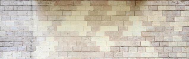 Rustic old beige white brick wall background photo