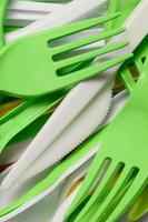 Pile of bright yellow, green and white used plastic kitchenware appliances photo
