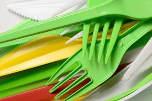 Pile of bright yellow, green and white used plastic kitchenware appliances photo