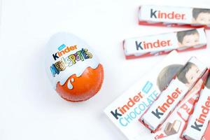 KHARKIV, UKRAINE - FEBRUARY 14, 2022 Kinder Chocolate various production. Kinder is a confectionery product brand line of multinational confectionery Ferrero. photo