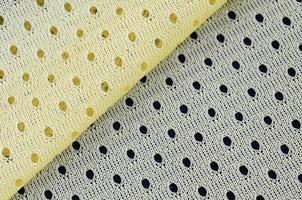 Yellow mesh sport wear fabric textile background pattern photo