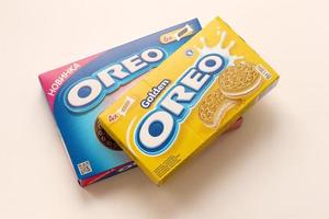 TERNOPIL, UKRAINE - MAY 28, 2022 Oreo golden and strawberry cheesecake crispy cookie box. The brand Oreo is owned by company Mondelez international photo