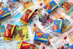 TERNOPIL, UKRAINE - JUNE 23, 2022 Love is - turkish bubble gums from 1990s popular in russian region. Various flavors of Love is chewing gum with liners about love photo