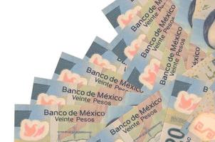 20 Mexican pesos bills lies in different order isolated on white. Local banking or money making concept photo