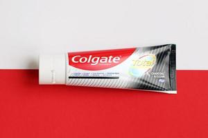 TERNOPIL, UKRAINE - JUNE 23, 2022 Colgate toothpaste, a brand of oral hygiene products manufactured by American consumer-goods company Colgate-Palmolive photo