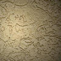 la textura del yeso decorativo beige en estilo escarabajo de corteza foto