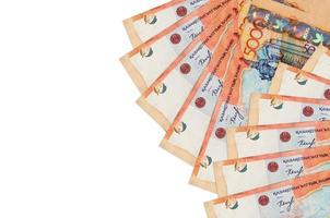 5000 Kazakhstani tenge bills lies isolated on white background with copy space. Rich life conceptual background photo