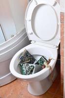 Old and unused computer details is recycled in toilet bowl photo