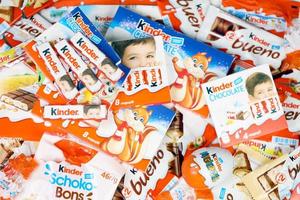 KHARKIV, UKRAINE - FEBRUARY 14, 2022 Kinder Chocolate various production. Kinder is a confectionery product brand line of multinational confectionery Ferrero. photo