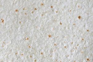 Homemade flat pita bread Turkish lavash background texture top view photo