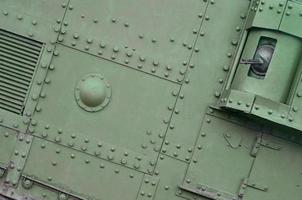 Abstract green industrial metal textured background with rivets and bolts photo