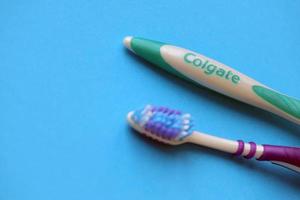 TERNOPIL, UKRAINE - JUNE 23, 2022 Colgate toothbrushes, a brand of oral hygiene products manufactured by American consumer-goods company Colgate-Palmolive photo