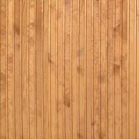 Close up of brown wooden fence panels. Many vertical wooden planks photo