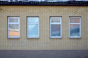 Brick wall with windows photo