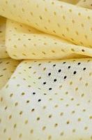 Yellow mesh sport wear fabric textile background pattern photo