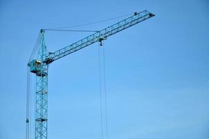 Tower crane against a blue sky photo