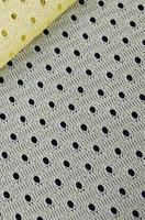 Yellow mesh sport wear fabric textile background pattern photo