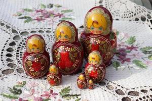 photo of nesting dolls on an embroidered napkin