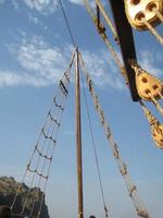 ship masts and blue sky photo