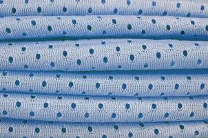 patrón de fondo textil de tela de desgaste deportivo de malla azul foto