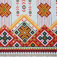 Traditional Ukrainian folk art knitted embroidery pattern on textile fabric photo